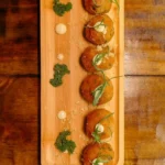 Bolinho de Bacalhau com Aioli de Limão Siciliano